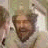 A 48x48 pixel buddy icon featuring a static image of a person with light brown hair and a neutral expression on the left, paired with bold black text reading "The King ROCKS!" on the right against a white background.