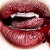 A close-up of a mouth with lips parted, showing teeth and tongue in a pixelated style.