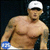 Pixelated image of a shirtless man with tattoos wearing a white cap and blue wristband, next to mirrored text "EMIN3M" on black background.