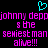Pixelated cyan heart symbol above pink text reading 'johnny depp johnny depp s the sexiest man alive!!!' on black background.