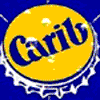 Yellow circular bottle cap with blue 'Carib' text on a blue background, featuring white crown-like edges and small white dots.