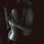 Animated grayscale icon shows a stylized figure with raised arms against dark background, transitioning from full-body view to partial torso view.