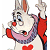 Pixelated cartoon character with white face, red nose, and wide grin, wearing red sleeves and purple collar, holding red heart, raised arm visible.