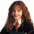 Pixelated portrait of a person with long brown hair wearing dark clothing and a striped tie against white background.