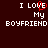 Pixelated text on dark red background with 'I LOVE My BOYFRIEND' in white, where the 'O' is replaced by a red heart symbol.