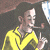 Animated icon shows a cartoon character in yellow shirt with dark hair, making hand gesture against blurred background; green text reads Original Icons .com on right.