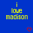Blue background with yellow text reading "i love madison" repeated across the image, red heart symbols in various positions.