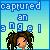 Pixelated image with blue gradient background displaying 'captured an angel' text above a figure with brown curly hair and orange skin tone.
