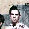 repeated images showing a person in a white shirt with red stains, overlaid with distorted text fragments