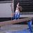 A gymnast in blue and white leotard performs on a balance beam with text overlays reading 'beam queen', 'yeah, that's me', and 'ashley'.