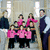 Group of people in pink and dark clothing with purple text overlays reading 'Jon and Kate Plus 8!' on a light background.