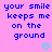 Pixelated blue text on pink background reads 'your smile keeps me on the ground' with two cyan hearts below.