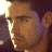A pixelated image of a person's profile on the left and green text reading 'OriginalIcons.com' on the right against a dark background.