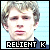 Pixelated static image of a person's face with light brown hair and a blue background, featuring bold text at the bottom reading "RELIENT K" in white letters on black rectangles.