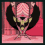 Pixelated character with pink chevron head covering, green face, black wings, and red cape performs animated arm movements against a striped background.