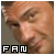 Pixelated close-up of a person's face with light brown hair and neutral expression, overlaid by bold black-and-white 'FAN' text at bottom left.