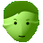 Pixelated green icon with rounded shape, two black square eyes, small black mouth, and light green facial shading against gray background.