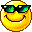 Pixelated yellow smiley face with green-tinted sunglasses, smiling expression on gray background.