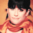 Pixelated image of a person with dark hair and an orange scarf on the left, next to an orange background with white text reading "Nothing rhymes with orange" on the right.