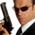 A pixelated close-up of a person in a black suit holding a dark handgun, wearing sunglasses and a white dress shirt.