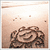 A static image with a light brown background and pixelated text on the right side.