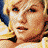 Pixelated contact sheet of three sampled frames from an animated icon featuring a blonde woman in various poses and expressions, arranged in a 2x2 grid with one empty cell.