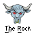 Pixelated blue bull head with red eyes, curved horns, and a green collar under black text reading "The Rock".