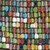 A static image composed of a dense grid of small, multicolored square pixels in various shades including blue, green, red, yellow, and brown.