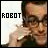Pixelated image of a person with glasses holding a phone to their ear, with the word ROBOT in blocky text on the left side.