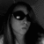 Black-and-white image of a person with long hair wearing dark sunglasses, showing subtle facial expression changes across three views.