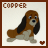 Two side-by-side pixel art frames of a dog character with brown and white fur, long black ears, and blue eyes, each framed by solid borders with