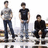 Three people stand in a on a light background; blue pixelated text reads "JONAS BROTHERS FOREVER AKISS!!" on a black background