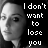 Black-and-white pixelated image of a person with text "I don't want to lose you" in white block letters on the right side.