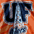 Pixelated image of stylized dark blue letters 'DF' with light blue outlines on an orange background, featuring a small '2015' text element below.