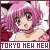 Pixelated anime-style character with pink hair and red eyes, wearing a white top with a red collar, against a blurred background of pink and white tones.