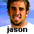 Pixelated portrait of a smiling man with short dark hair and stubble, set against blue gradient background with white lower section.