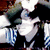 Animated sequence of a character with dark hair and blue-and-white striped clothing, showing head movement against a blurred background.