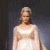A pixelated contact sheet showing two frames of an animated icon featuring a woman in a white dress on the left and green text reading "Original Icons .com" on the right against a dark background.