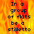 A pixelated text-based image with fiery orange and yellow background displaying "In a group of flats be a stilletto" in black block letters.