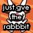 Pixelated white rabbit with pink nose and mouth against orange striped background, text overlays in black boxes reading "just gve the rabbbit and we will all" on left and "its fikin Trix Cereal be HAPPY!" on right.