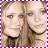 Two identical figures with light brown hair and neutral expressions, positioned side-by-side against a purple-and-white checkered border.