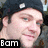 Pixelated close-up of a person's face with light skin, dark hair, and visible ear; black rectangular banner at bottom left contains white text 'Bom' on solid background.