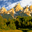 Animated landscape of golden mountains and green forests under a blue sky with white clouds, transitioning through three distinct horizontal sections.