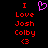 Pixelated red text on black background with a purple heart symbol above the text.