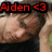 A pixelated image of a person with closed eyes and hands behind their head, overlaid with red text reading "Aiden <3 Is my Love.<3".