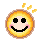 Pixelated circular icon with yellow-orange gradient border, black eyes, pink cheeks, and a smiling mouth; animated sequence shows varying numbers of small yellow sparkles above the head.