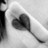 Black-and-white image of a hand holding a heart-shaped object with text about people coming into lives and being time-wasters.