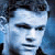 Two side-by-side pixelated images of a person's face with blue-toned skin and dark hair, below which is light blue text reading "Matt Damon" on a gray background.