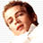 Pixelated static icon of a person's face with brown hair, closed eyes, and an open mouth showing teeth against a white background.