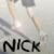 A static image shows a person in motion with the text 'NICK' below, featuring blurred limbs and a light-colored background.